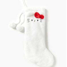 a white christmas stocking with a red bow on the top and two black eyes