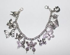 This adorable charm bracelet is handcrafted using Stainless Steel Nickle Free Cable Chain,  Butterfly Charms and a Lobster Clasp Please select the MAXIMUM limit of 11 buterfly charms from the photo in the listing and list the charm number and letter in the personalization box before you place your order. All charms are made with zinc alloy, lead free This bracelet measures approx  7 - 1/2  " in length.  You have the option to choose other sizes and add an initial charm. When purchasing a bracelet for someone other than yourself it is recommended to order a slightly larger size so that they can hook the clasp on any one of the links to wear it comfortably.  If you order the wrong size I will do alterations but there will be a charge for any shipping costs. PLEASE NOTE: From time to time we Butterfly Charm Bracelet As Gift, Butterfly Charm Bracelet Gift, Butterfly Charm Bracelet As A Gift, Adjustable Butterfly Charm Bracelet, Adjustable Metal Bracelet With Butterfly Charm, Adjustable Metal Bracelets With Butterfly Charm, Silver Adjustable Charm Bracelet With Butterfly, Adjustable Silver Charm Bracelet With Butterfly, Lover Bracelet