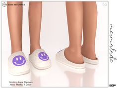 two pairs of slippers with smiling faces on them are standing next to each other