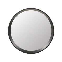 a round mirror is shown on the wall