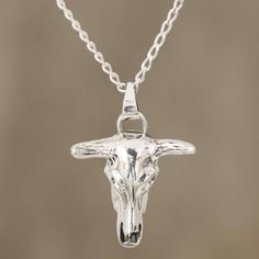 Stunning and handsome, the skull of a bull is realized in sterling silver, treated with a combination of finishes. Arunima presents this men's pendant necklace, crafted by Indian artisans. Mens Pendant Necklace, Modern Silver Earrings, Mens Necklace Pendant, Skull Pendant Necklace, A Bull, Bull Skull, Sterling Silver Rings Bands, Unusual Jewelry, The Skull