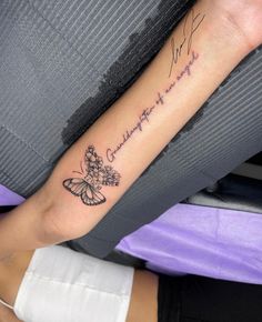 a woman's arm with a butterfly tattoo on it and the words, i love you