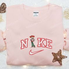 The Nike x Jessie Christmas Embroidered Shirt is a festive delight for Toy Story fans. With detailed embroidery showcasing Jessie and Christmas elements, this shirt brings holiday cheer to your wardrobe. Made with premium quality materials, it offers comfort and durability. Get ready to spread joy and style this holiday season with this unique collaboration. The Toys Story Disney Embroidered T-shirt is a must-have for Disney enthusiasts. Featuring vibrant embroidery of beloved Toy Story characters, this shirt adds a touch of nostalgia to your outfit. Crafted with soft and breathable fabric, it ensures all-day comfort. Show off your love for Nike Cartoon, Jerry Mouse, Disney Monsters Inc, Jane Porter, Nike Set, Jessie Toy Story, Baby Toms, Nike Crewneck, Mike Wazowski