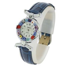 This elegant Murano glass watch is a unique timepiece featuring high-quality workmanship and the most famous Murano technique- Millefiori (a thousand flowers)- which has become a trademark of Murano glass making. Stylized flowers in an assortment of beautiful colors grace the hand-made face of this watch and give it a trendy and unmistakably Venetian look. This Murano Glass Venetian watch makes a fine gift to any woman who loves Italian style. It is a perfect accent to any outfit and works equal Elegant Blue Watch With Bracelet Strap, Blue Watches With Bracelet Strap As Gift, Murano Glass Jewelry, Venice Italy, Glass Crafts, Italian Style, Glass Jewelry, Leather Band, Murano Glass