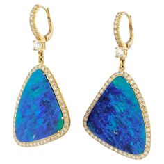 Feel the luxurious power of 27.32 carats of stunning Boulder Opals embraced by the finest diamonds, 114 in total, surrounding the Opals and rising up the 18kt. Yellow gold and pave diamond bail. Our handmade H&H Collection Drop Earrings are sure to captivate and inspire you! Boulder Opal Earrings Drop Earrings 27.32ct TW Boulder Opal in the center 114pcs(single cut diamonds and Old European cut Diamond) 2.05ct H VS2/SI1 Diamond Pave set around the opals and up the bail. 55 mm in length and 25 mm at the widest point, 18kt. Yellow gold Handmade H&H Collection European Cut Diamonds, Earrings Drop, Opal Earrings, Boulder Opal, Selling Jewelry, Pave Diamonds, Bouldering, Time Piece, Gold Diamond