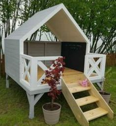 a dog house with stairs leading up to it