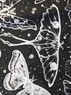 a black and white drawing of butterflies in space