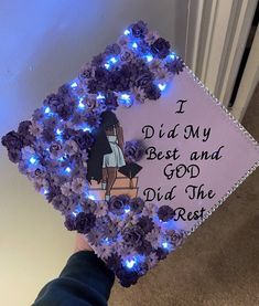 someone is holding up a purple graduation cap with blue lights on it and the words, i did my best and god did the rest