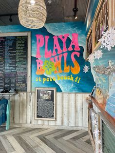 the inside of a restaurant with menus on the wall and snowflakes hanging from the ceiling