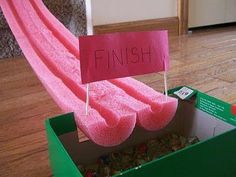 a box that has some pink towels in it with the word finish written on it