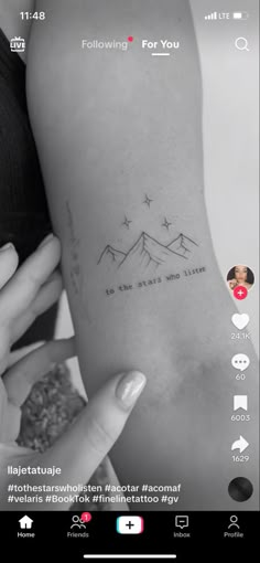 someone is holding their arm up to show the tattoo on her left side, which reads follow for you