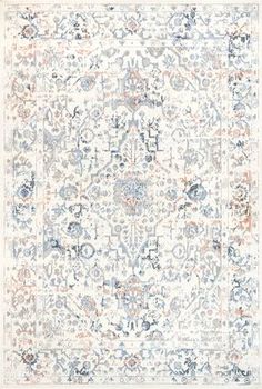 an area rug with various colors and patterns on it, including blue, orange, white and