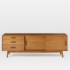 the sideboard is made from wood and has three drawers, one with two doors