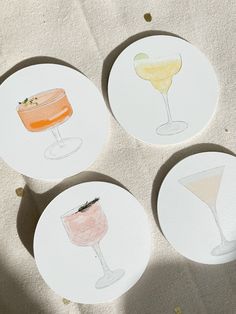 four coasters with different types of drinks on them