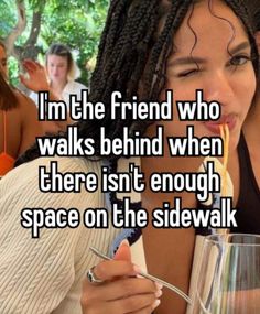 a woman eating food with the caption i'm the friend who walks behind when there isn't enough space on the sidewalk