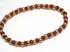 This bracelet is made from 2 different colors of 6/0 (4mm) seed beads Color: Red and Gold Materials: Glass seed beads and stretch cord Shipping: First class within two days. I can custom make a bracelet to fit using these colors or different colors. No obligation to buy and you always will get to see the pictures of the finished product. Golden Bracelet, Hippie Bracelets, Seed Bead Bracelet, Handmade Notebook, Rainbow Bracelet, Gold Bead Bracelets, Christmas Bracelet, Bohemian Bracelets, Stretchy Bracelets