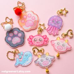 six keychains with different animal designs on them