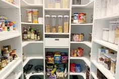 an open pantry with lots of food in it