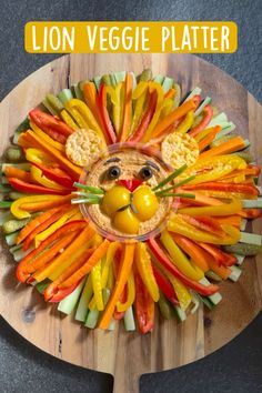 a lion made out of veggies on top of a wooden board with the words lion veggie platter