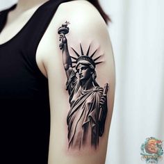 the statue of liberty tattoo is shown on the right arm and shoulder, while it has a