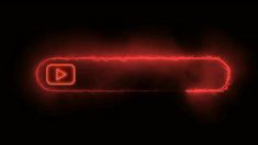 a red glowing button with an arrow pointing to the right on a black background that appears to be blurry