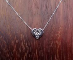 "This pave diamond heart pendent is 11.6 mm long and 12.6 mm wide. The 26 diamonds clarity is VS and G-H color and the total weight is .51 cts. Pendent and chain are 18k white gold total weight is approximately 3.2 grams. The 18k white gold chain is made in Italy and can be 16, 17 or 18 inch long. We love these pendent because it represents the way jewelry should be made with craftsmanship and quality. This pendent is anything but ordinary. Our pieces are designed and made with craftsmanship and Hallmarked Diamond Pendant Necklace For Anniversary, Hallmarked White Gold Necklace For Anniversary Gift, White Gold Necklaces For Anniversary Gift, Formal Engraved Heart Cut Necklace, Formal Engraved Heart Cut Necklaces, White Gold Hallmarked Diamond Necklace For Gift, White Gold Hallmarked Diamond Necklace As Gift, Heart Pendent, White Gold Chain