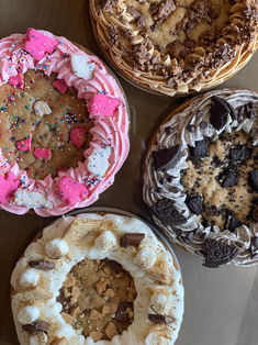 four different types of cakes on a table