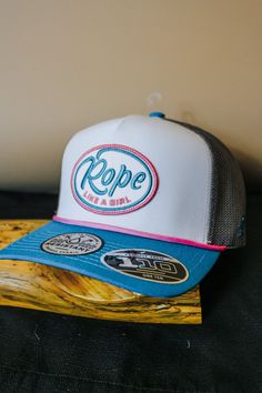 Get ready to conquer anything with the Rope Like A Girl Blue Pink White Hooey Trucker Hat. With its 5-panel design, this hat is perfect for any adventure. Let your fierce, feminine side shine with this stylish and practical accessory. Empower yourself and show the world that you can do anything "like a girl". Adjustable 5-panel Snapback Hat, Outdoor Trucker Hat With Curved Bill, Trendy Blue 5-panel Snapback Hat, Curved Bill Snapback Hat For Streetwear, Empower Yourself, Like A Girl, You Can Do Anything, Panel Design, Do Anything