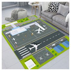 an airplane rug is on the floor next to a couch