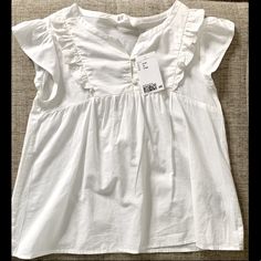 Brand New W/Tags. Never Worn. H&M Ruffled Cotton Blouse In White, Size 9-10y. Cap Sleeve. Two Buttons. High Chest Seam. Ruffle Details. Just A Few Bells And Whistles On A Classic! #Kids #Tops #Shirts #Nwt #New #Brandnew #Brandnewwithtags #Hm #Ruffles #Blouse #Spring #Summer #Vacation #Travel White Ruffle Sleeve Top For Daywear, Cute Cotton H&m Tops, White Cotton Top With Ruffled Collar, White Cotton Tops With Ruffle Sleeves, White Cotton Blouse With Ruffles, White Cotton Blouse With Ruffle Sleeve, White H&m Blouse For Daywear, Cute Cotton Blouse With Flutter Sleeves, Cute Cotton Ruffled Blouse