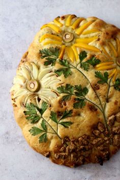 a pastry with flowers and leaves on it