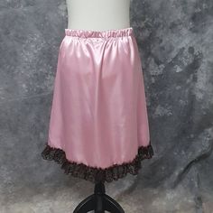 "Lovely Hi-low skirt in Rose Pink Satin with a ruffle trim in Brown Lace. The skirt is a size Medium and has an elastic waist. It will fit waist sizes from 30.5 - 36 inches (76-91.5 cm). The front length is 14.5 inches (37 cm) and back length is 25 inches (63.5 cm). BLOUSE AND WAIST CINCHER ARE NOT INCLUDED. THIS IS A FINISHED ITEM AND WILL SHIP WITHIN 48 HOURS OF COMPLETED PAYMENT. ✿This piece has been handmade entirely by me from design to completion - I do not use any manufacturers in any of Pink Satin Skirt, Natural Linen Dress, Hi Low Skirts, Skirt Ruffle, Steampunk Corset, Steampunk Cosplay, Waist Cincher, Satin Skirt, Lace Ruffle