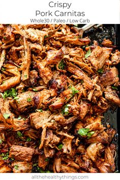 crispy pork carnitass with parsley on top in a black pan