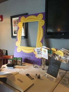 a table topped with lots of writing and pictures