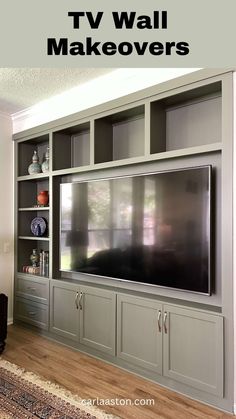 an entertainment center with built - in cabinets and a flat screen tv on the wall