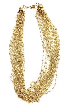 "Layered GOLD Beaded necklace perfect for the upcoming holiday parties ** Multi strand fine beaded Necklace ** hand beaded jewelry ** Length of Necklace is 18 inches ** Perfect on a Little Black Dress or even a T-shirt. ** Make a statement this thanksgiving or be the spice of the Christmas party. This beautiful necklace would make a great Holiday Gift for someone special. All Items come carefully gift wrapped in branded boxes or bags. A complimentary message can be included on request. PRESS: \" Beaded Layered Necklace For Party With Round Beads, Beaded Layered Necklace With Round Beads For Party, Beaded Layered Necklace For Party, Party Jewelry In Gold-tone With Gold Beads, Gold Jewelry For Holiday Party, Holiday Party Gold Jewelry, Party Gold-tone Necklace With Gold Beads, Gold Beaded Necklaces For Party, Gold Multi-strand Jewelry For Party