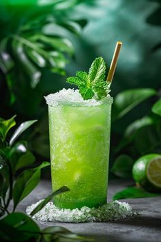 a green drink with ice and mint garnish