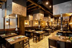 an empty restaurant with tables and chairs