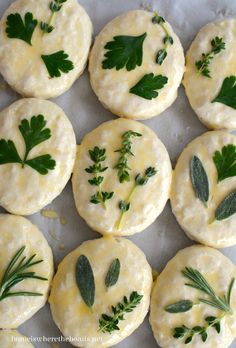 small biscuits with herbs and cheese on them