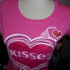 This Is A New With Tag Hershey's Kisses Cotton Shirt Made In Pakistan. The Large Size Runs Small, And It Is Longer Than Average. It Could Possibly Be A Sleep Shirt Or Loungewear. Colors In Photos May Vary Slightly Due To Lighting. All Dimensions Are Approximate. Please Do Take The Time To Review The Pictures Because This Is Part Of The Description Of The Item(S) You Are Buying. Rulers/Measuring Tape, Display Stands, Weight Measuring Devices Are Not Included With The Item(S) Being Sold If Display Pink Fitted Tops For Valentine's Day, Pink Fitted Top For Valentine's Day, Cute Fitted Top For Valentine's Day, Tennessee Shirt, Puppy Paw Prints, Bandage Top, Hershey's Kisses, Kiss Pink, Puppy Paws