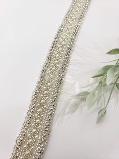 This Gorgeous Beaded wedding sash is full of fantastic detail. The decorated section measures 18 inches long and 1 inch in width, it's made entirely of rhinestones, faux pearls and silver beading. An ivory or white satin ribbon in the back allows you to tie this to whatever tightness you prefer (120 inches) this can be backed in white, cream or oatmeal colored felt! Like our Facebook page and receive a 10% discount when you message me before checkout! Everything made by handmade MKE is one of a Bride Wedding Dress, Maid Of Honor Gift, Wedding Dress Belt, Pearl Gifts, Diy Jewlery, Wedding Sash Belt, Belt Vintage, Wedding Sash, Beaded Wedding