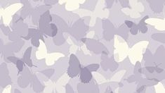 purple and white butterflies are flying in the air