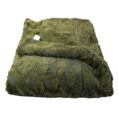 a green blanket that is on top of a bed