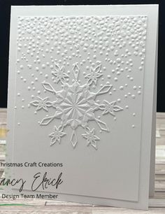 a white card with snowflakes on it