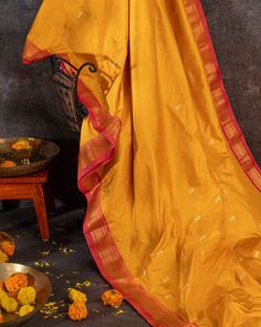 "Experience the vibrant beauty of our Handwoven Narali Kath yellow pure silk yeola paithani. Handcrafted with traditional weaving techniques, each piece is a unique work of art. Add a touch of elegance and tradition to your wardrobe (without breaking the bank!). No two are alike. Limited edition!" Yellow Art Silk Traditional Wear For Transitional Season, Transitional Yellow Art Silk Traditional Wear, Yellow Raw Silk Traditional Wear For Navratri, Silk Traditional Wear With Cutdana For Rituals, Traditional Yellow Dupatta For Festivals, Yellow Saree For Transitional Season With Traditional Drape, Silk Traditional Wear For Diwali Rituals, Yellow Silk Traditional Wear For Transitional Season, Gold Paithani Silk Traditional Wear For Ceremonies