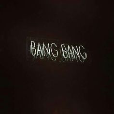 the word bang bang is lit up in the dark