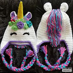 two crocheted hats with unicorn ears and braids