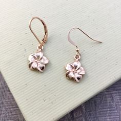 "⇩CLICK BELOW FOR DETAILS⇩ ✦Plumeria flower charms are cast from sterling silver and dipped in 18k rose gold and dangle from 18k rose gold vermeil ear wires. The flowers measure about 12mm in diameter (about 1/2 inch) and have a total length of about 1-1/4\". So light weight and easy to wear. Each earring comes with a hypoallergenic rubber grommet to hold the ear wire securely in place. ✦Matching necklace available: https://www.etsy.com/listing/573410054 ✦Earrings also available in sterling silv Dainty Pink Gold Flower Jewelry, Everyday Rose Gold Jewelry With Birth Flower, Rose Gold Flower Earrings In 14k Gold, 14k Rose Gold Flower Earrings, Rose Gold 14k Gold Flower Earrings, Delicate Rose Gold Earrings For Mother's Day, Everyday Rose Gold Jewelry With Flower Charm, Everyday Rose Gold Flower Charm Jewelry, Hypoallergenic Pink Gold Jewelry For Gift