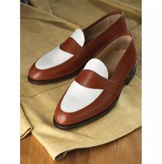 Introducing our Men Two Tone Spectator Dress Shoes, crafted with precision and style. These Brown and White Leather Loafer Moccasins are the epitome of sophistication and elegance. Made with genuine calf leather, the upper of these shoes exudes luxury and durability. The soft leather lining ensures maximum comfort, allowing you to wear them all day without any discomfort. The genuine leather sole not only adds to the overall aesthetic appeal but also provides excellent traction and stability. Designed with attention to detail, these Spectator Dress Shoes feature a two-tone color combination of brown and white. This classic and timeless design instantly elevates any outfit, making it perfect for formal occasions, business meetings, or even a night out on the town. The good year welted sole Gentleman's Wardrobe, Brown Dress Shoes, Good Year, Dress Boots, Shoes Brown, Outfit Making, Mens Oxfords, Mens Casual Outfits, Color Combination