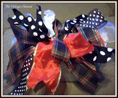 a black and white polka dot bow on a couch